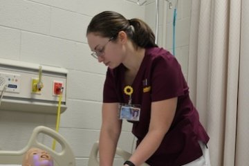 Nursing student and sim patient