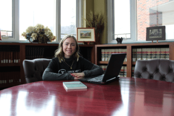 MS Sport and Performance Psychology student on a lap top