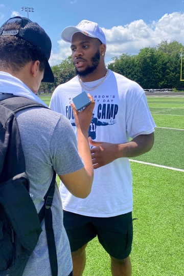 Toron James interviews Micah Parsons while on assignment this summer for his internship.