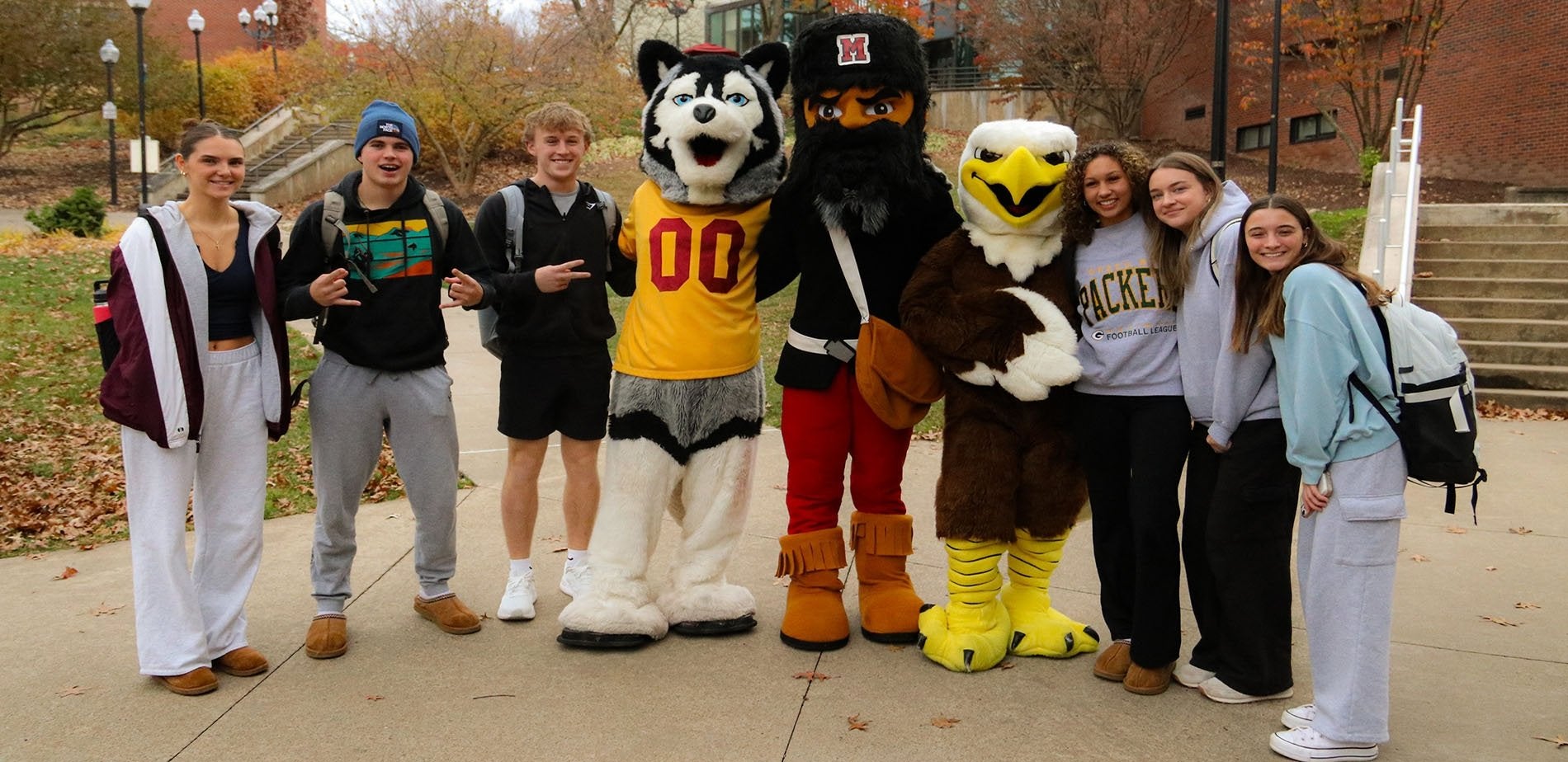 Students posing with mascots of Commonwealth University.