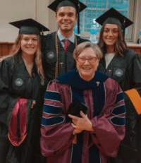 Professor Yvette Ingram and graduate students at graduation