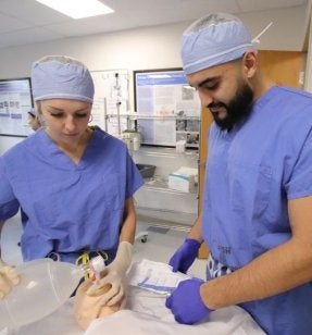 DNP Nurse Anesthesia students working in the lab