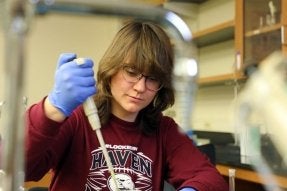 A CU-Lock Haven Honors Biochemistry student conducting an experiment in a lab