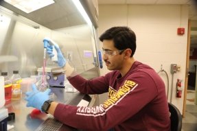 A CU-Bloomsburg Health Sciences alum in a chemistry lab
