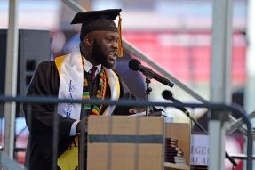 Joar Dahn speaking at commencement.