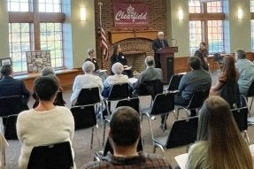 C. Alan Walker speaking.