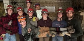 Quest students pose for photo during caving trip