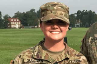 A headshot of a girl in a military uniform.