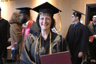 A female in a cap and gown. 