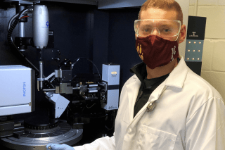 A man working in a lab. 