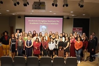 A group of people standing on stage.