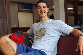 A guy sitting on a couch.