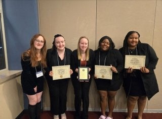 A group of girls standing together. 
