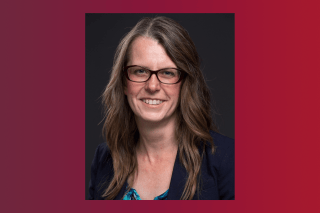 A headshot of a woman. 