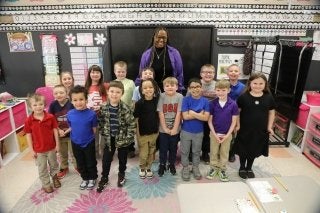 An Early Childhood Education major at CU-Bloomsburg standing with her class during her student teaching experience