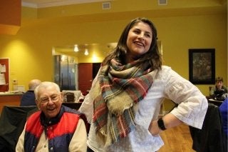 A CU-Bloomsburg Psychology student completes service learning at a local senior center and is pictured smiling with an older adult