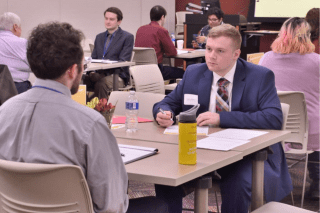 Andy McNeal conducts a mock interview with a student at a recent CIBC