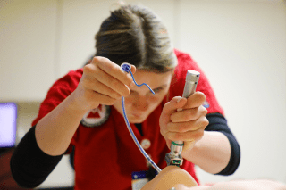 A Respiratory Care student at CU's Sayre Campus learning hands-on in a simulation lab