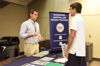 A student speaks to a recruiter from the PA Office of Budget at a recent Career Connection Expo at Commonwealth University