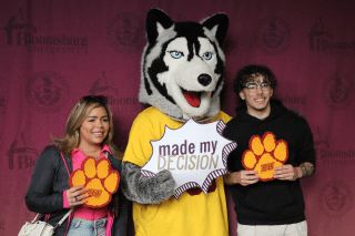 Bloomsburg Huskies mascot with students at Commonwealth University accepted students day