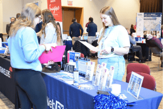 A recruiter from WebFX reviews a resume from a Communication Studies senior.