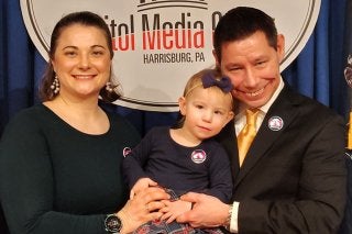 Elisabeth and Dan Heckert with their daughter.