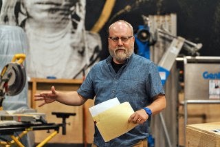 Professor David Miller directing a play.