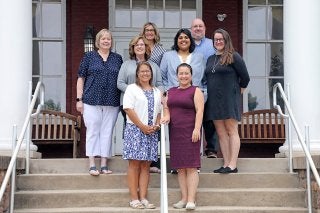 Alumni and Profession Engagement team on Carver Hall steps.