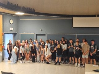 1993 Lock Haven alumnus Michael Watkins poses with TRIO SSS students in Ulmer Hall following an on-campus presentation on Sept. 10.