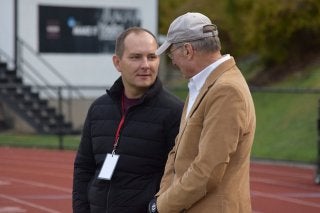 Mansfield Athletic Director Andrew Petko speaks with Steve McCloskey during an athletic event at Van Norman Field