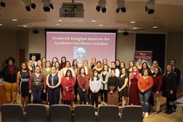 A group of people standing on stage.