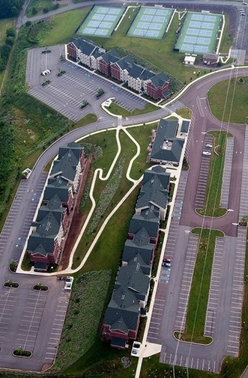 Aerial photo showing the three buildings and community center of the Jessica Kozloff Apartment Complex