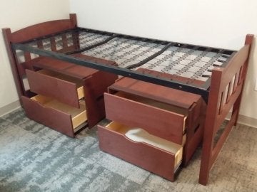 Bed and drawers in a bedroom of David Soltz hall