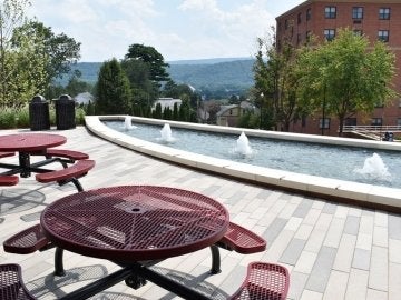 Fountains and tables outside the main entrance of David Soltz Hall