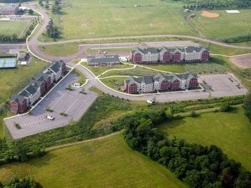 Aerial photo showing the three buildings and community center of the Jessica Kozloff Apartment Complex