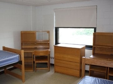 Lycoming Hall room with two beds, two desks and a dresser