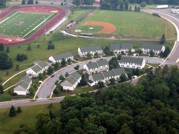 Aerial photo of Mount Olympus Apartments with baseball field and football stadium in the background