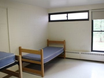 Bedroom of Schuylkill Hall showing two beds and windows