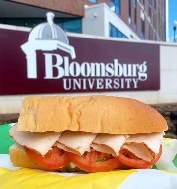 Turkey sub from Subway in front of Bloomsburg University sign