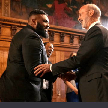 Brandon Gill '22 shakes hands with PA Governor, Tom Wolf at the PA Capitol