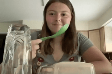 A girl eating. 
