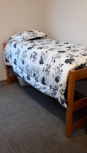 Bed in Fairview Suites shared bedroom at CU-Lock Haven