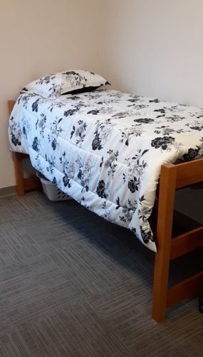 Bed in Fairview Suites shared bedroom at CU-Lock Haven