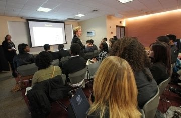 Sankofa conference - speaker in front of projector