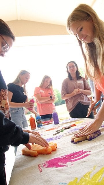 Freshmen complete a project during orientation at Commonwealth University-Lock Haven, formerly Lock Haven University.