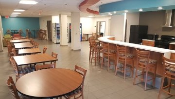 Kitchen and tables in Fairview Suites at Commonwealth University - Lock Haven