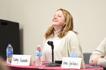 Cathy Zavacki '99 reacts to the conversation during an alumni panel at the Catch Conference