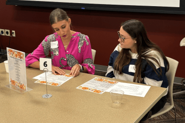Emily Bocan '12 speaks with a student at the latest William and Elizabeth Bent Leadership Boot Camp