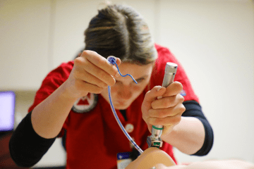 A Respiratory Care student at CU's Sayre Campus learning hands-on in a simulation lab