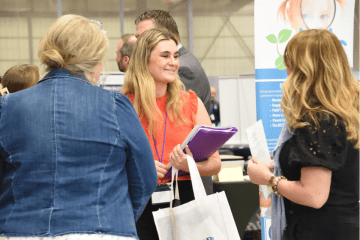 A student speaks to a recruiter at the latest Education Career Connection Expo at Commonwealth University